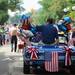 A parade participant waves to the crowd as he cruises down Main St.  during the 23rd Annual Ann Arbor Jaycees Fourth of July Parade on Thursday, July 4, 2013 on South State Street in downtown Ann Arbor. Melanie Maxwell | AnnArbor.com